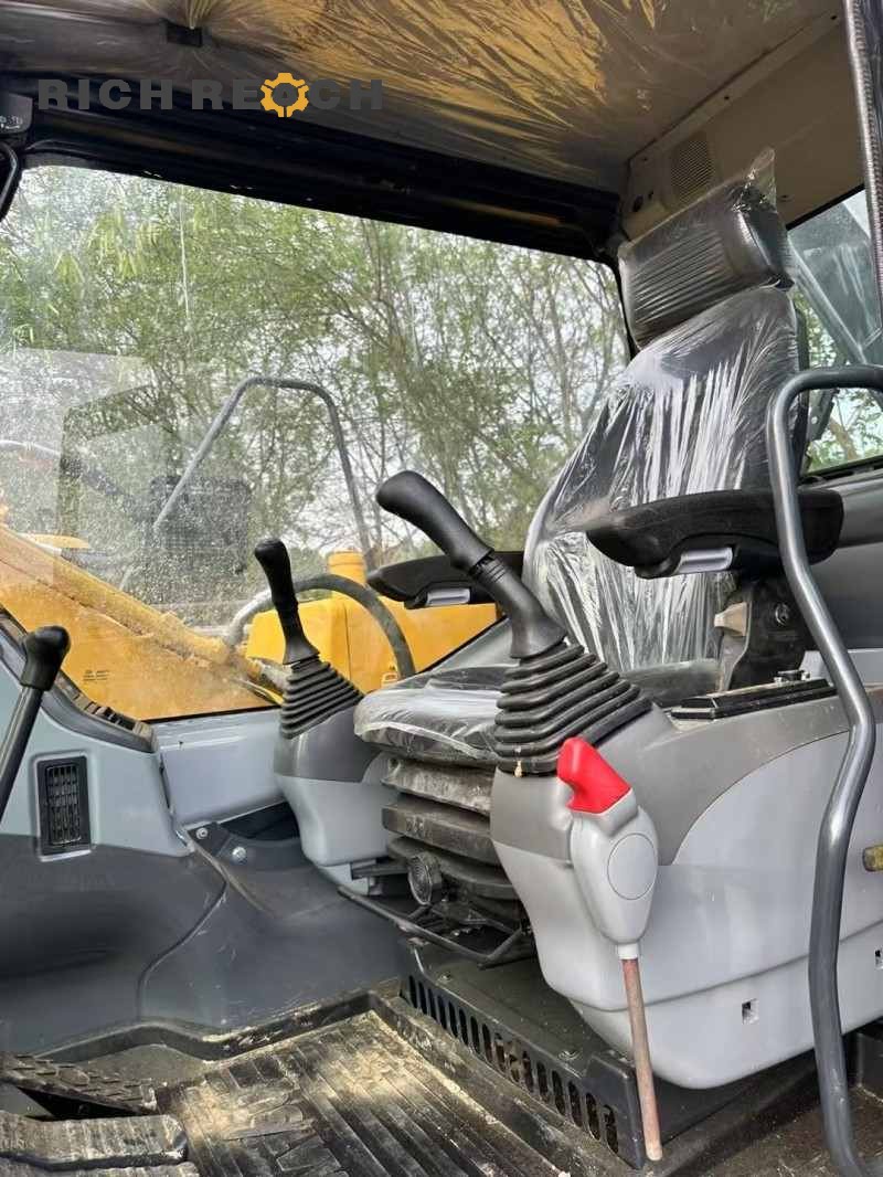 Rear view of a 2023 Komatsu PC130-8 excavator with 500 hours, listed for $16,667